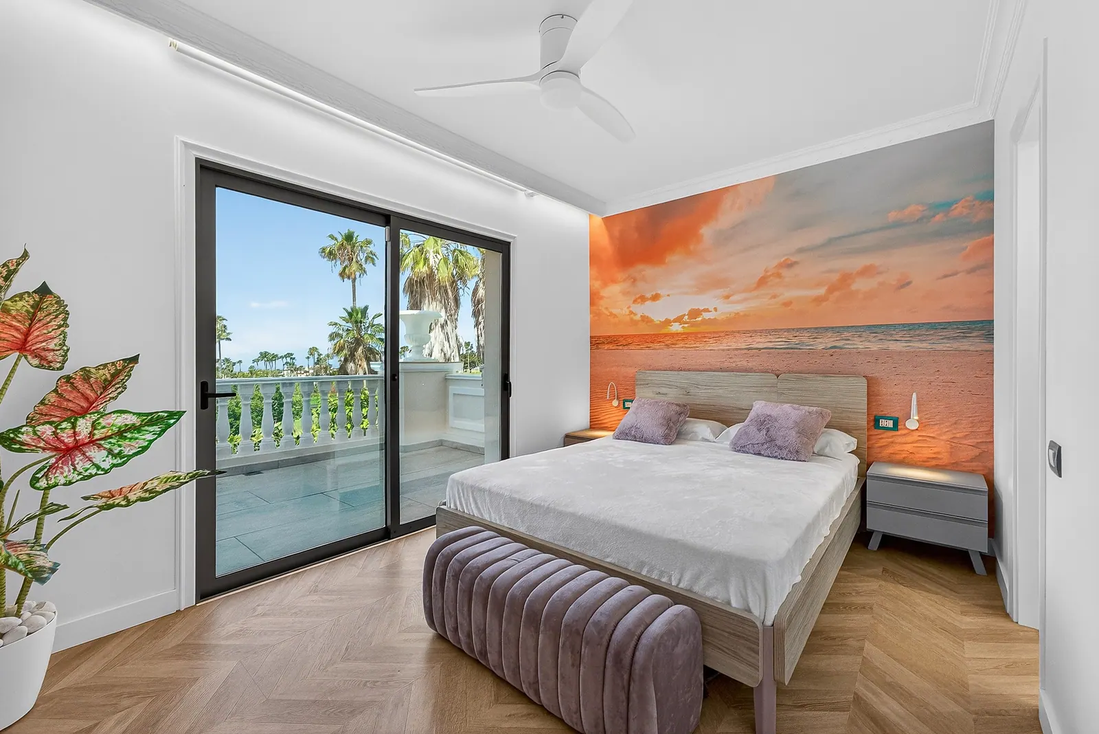Dormitorio con mural de atardecer